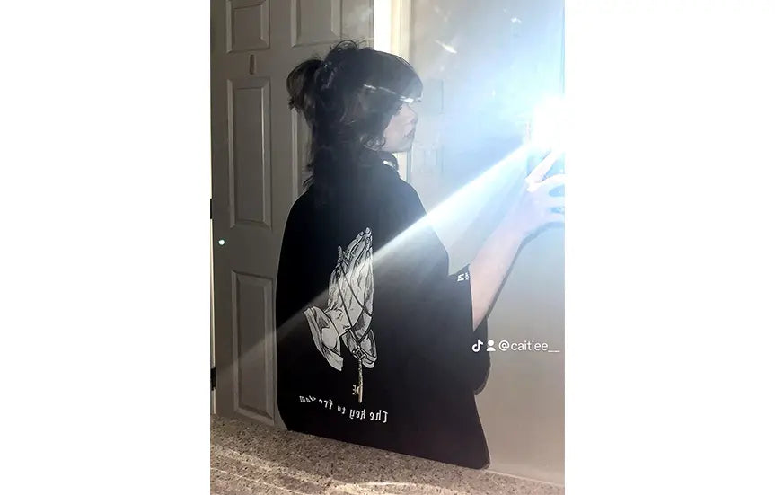 Caitiee in our Key to Freedom Tee