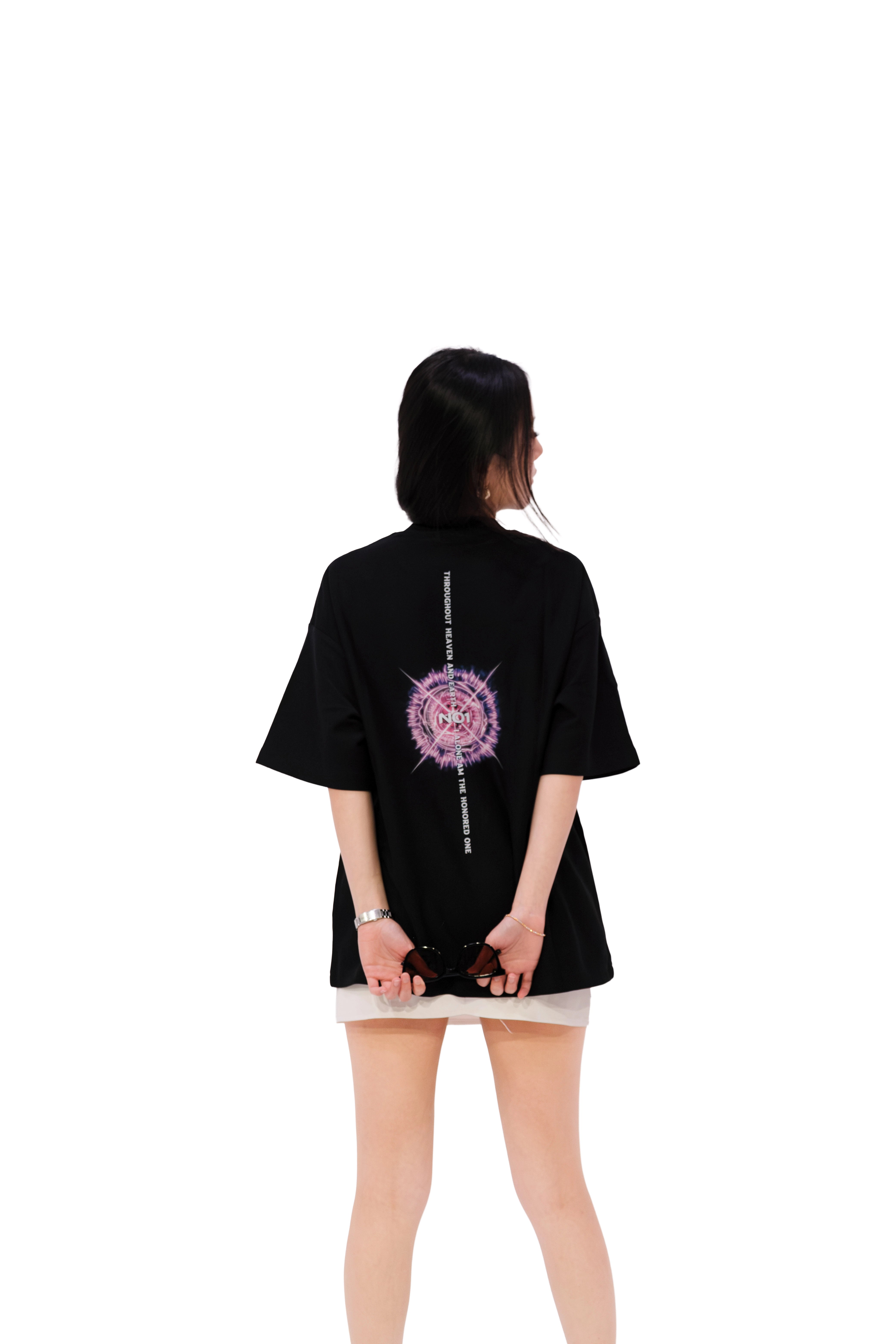 Back view of black oversized subtle anime t-shirt featuring bold graphic inspired by Gojo Satoru’s “Honored One” phrase from Jujutsu Kaisen, with minimalist NO1 logo at the upper center. Premium anime streetwear from NO1 Apparels, worn by female model.