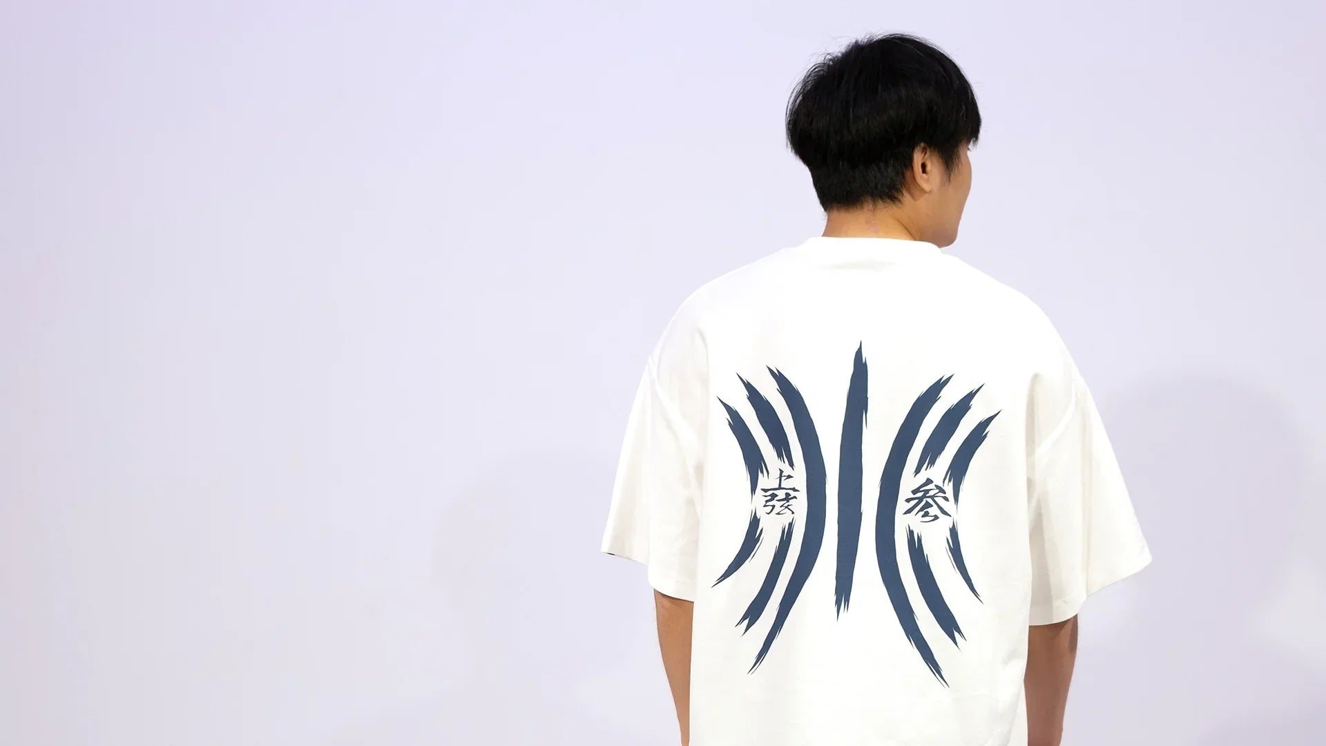 Back view of NO1 Apparels’ oversized Akaza-inspired Demon Slayer t-shirt featuring subtle navy markings