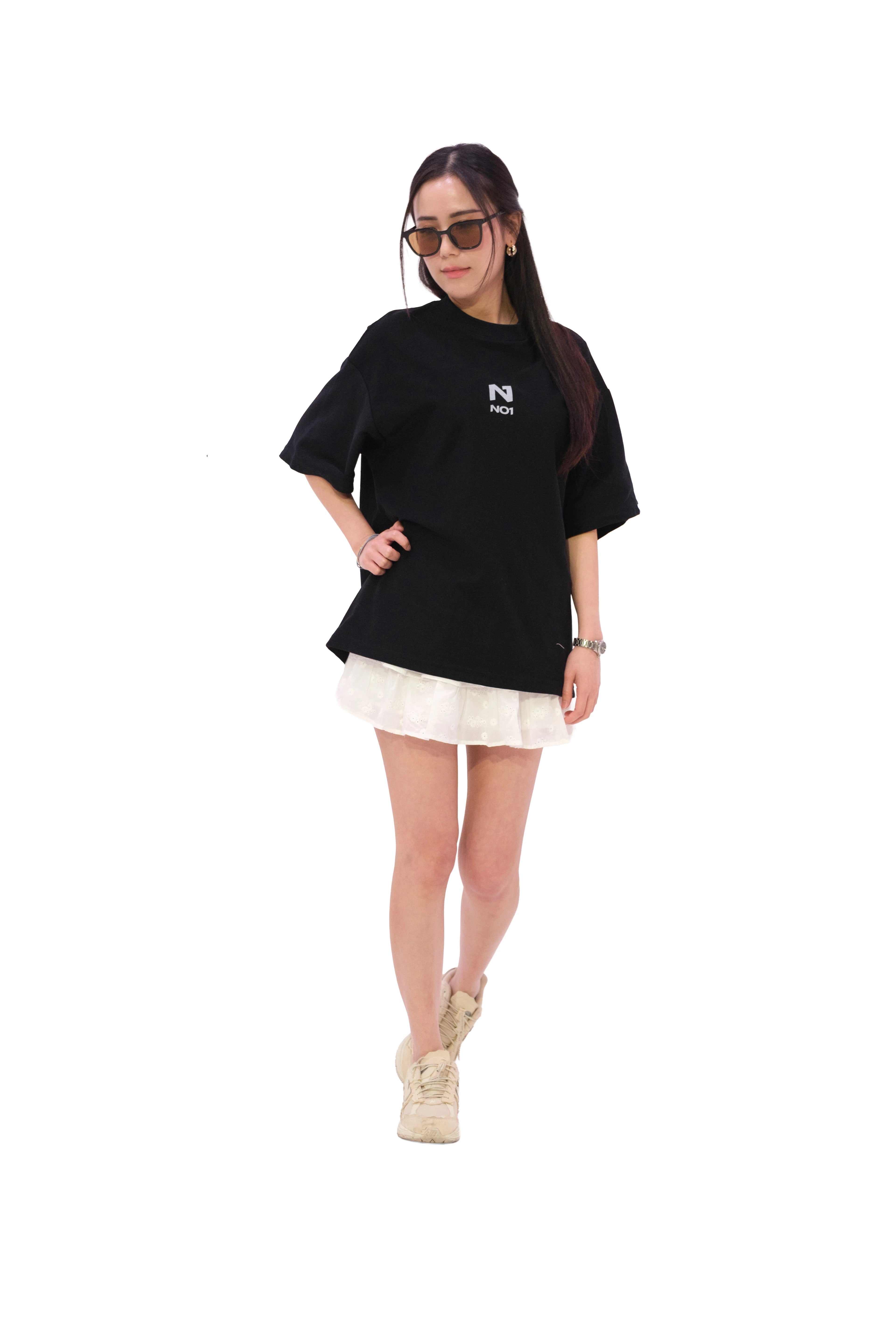 Front view of oversized black NO1 Apparels anime t-shirt, subtle anime clothing with minimalist NO1 logo design, worn by female model.