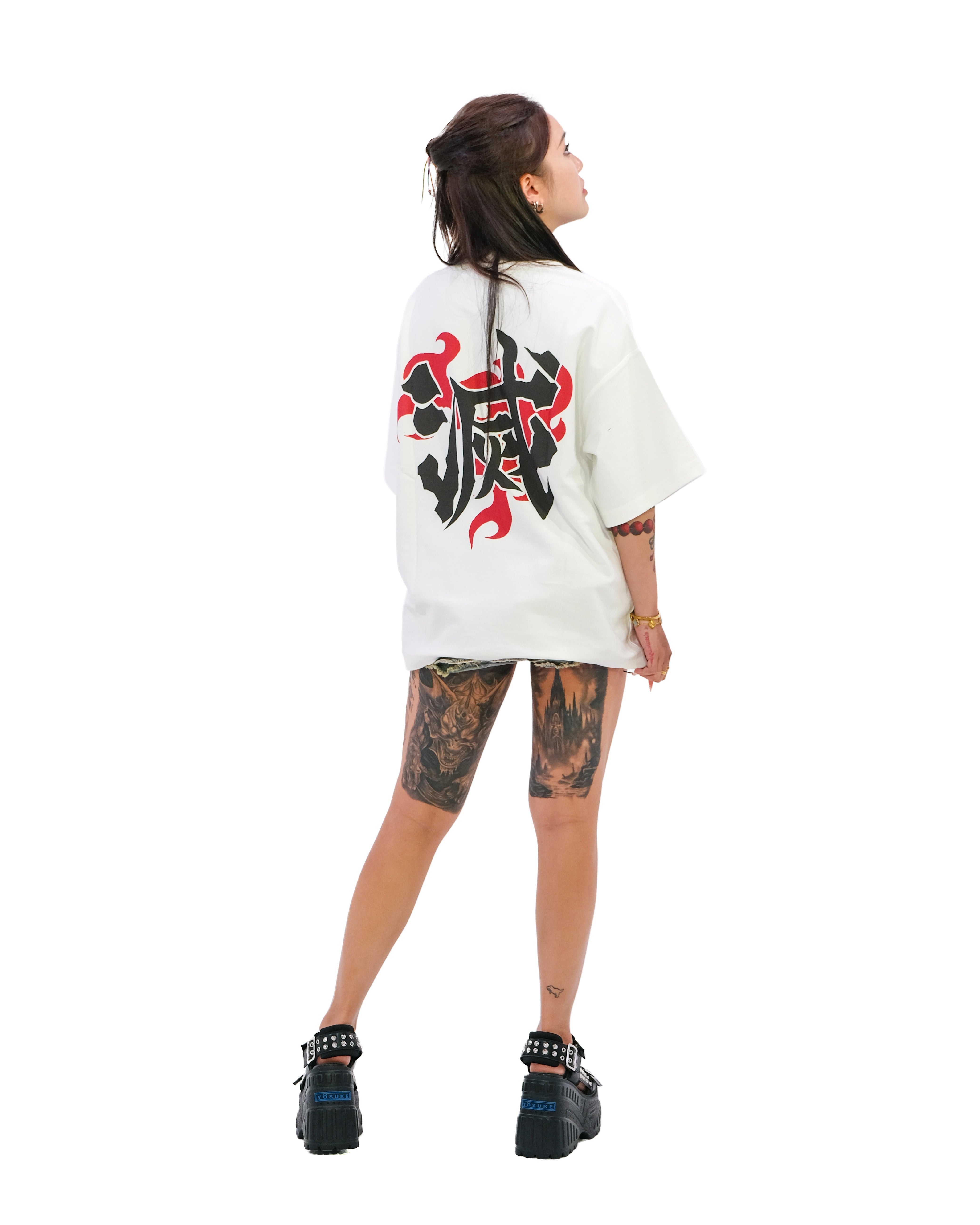 Back view of oversized white NO1 Apparels anime t-shirt, subtle anime clothing inspired by Demon Slayer, Demon Slayer Corps Uniform design featuring the 滅 motif, worn by female model.