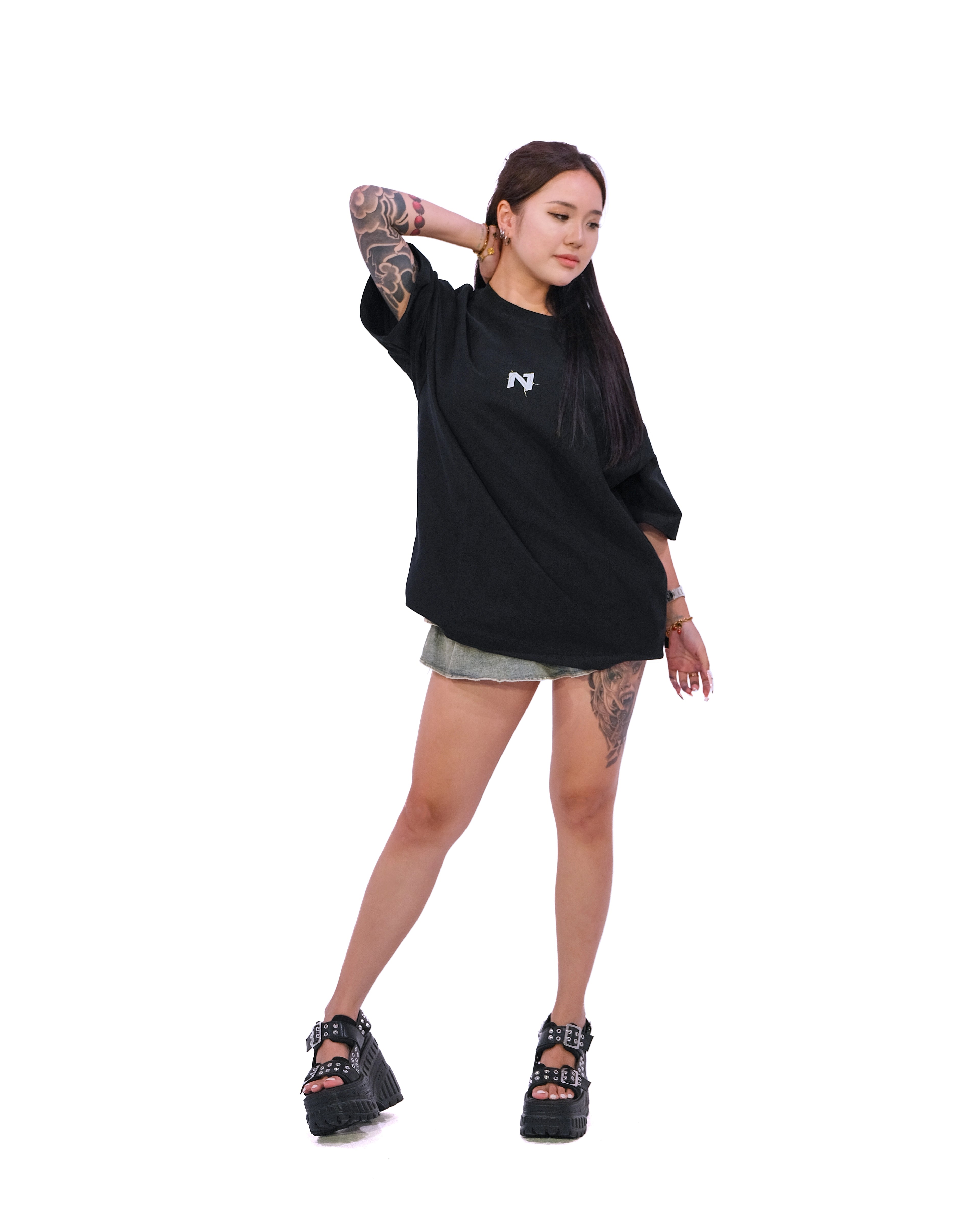 Front view of oversized black anime t-shirt with subtle minimalist design.