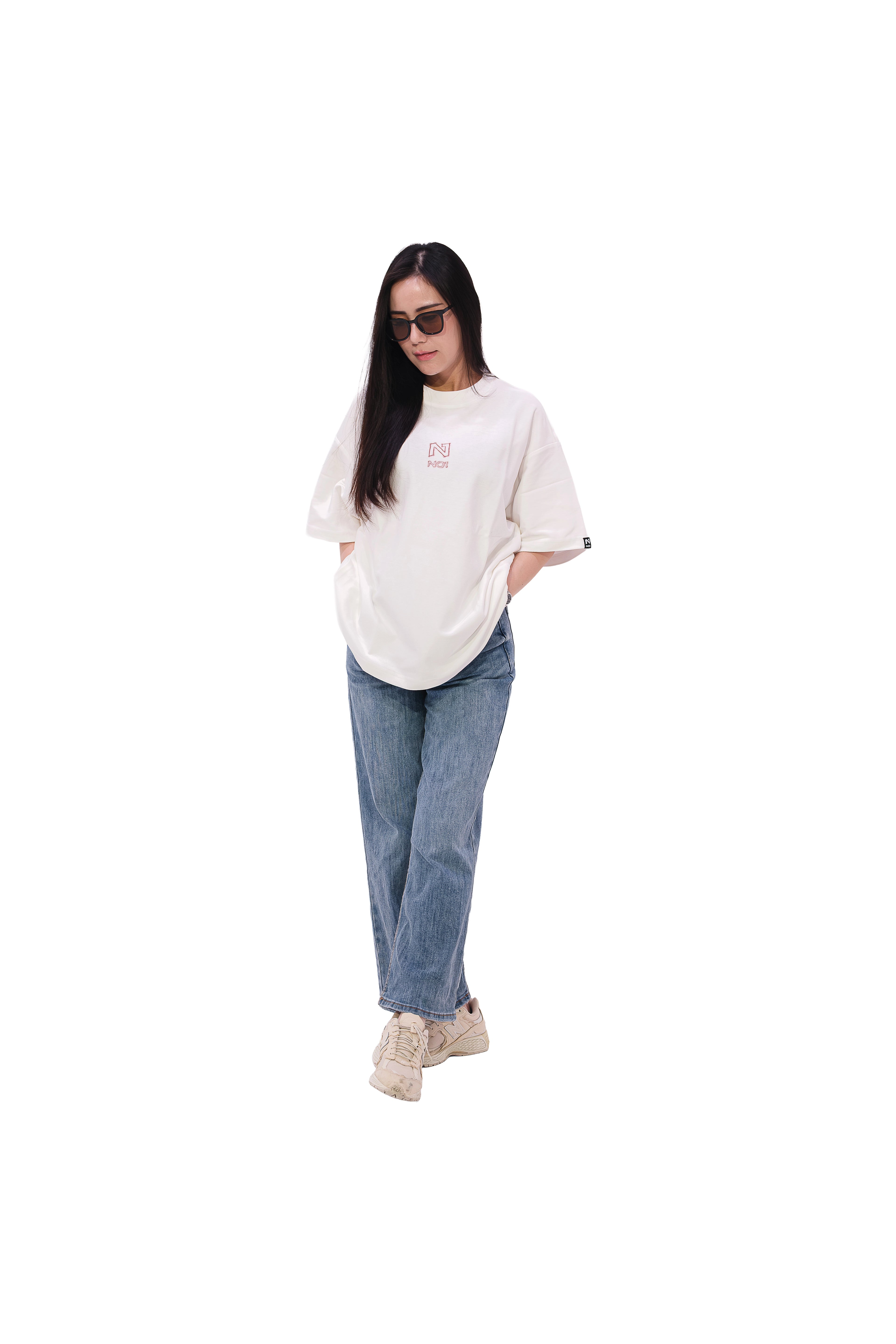 Front view of oversized white NO1 Apparels anime t-shirt, subtle anime clothing with Jiraiya headband graphic inspired by Naruto, worn by standing female model.