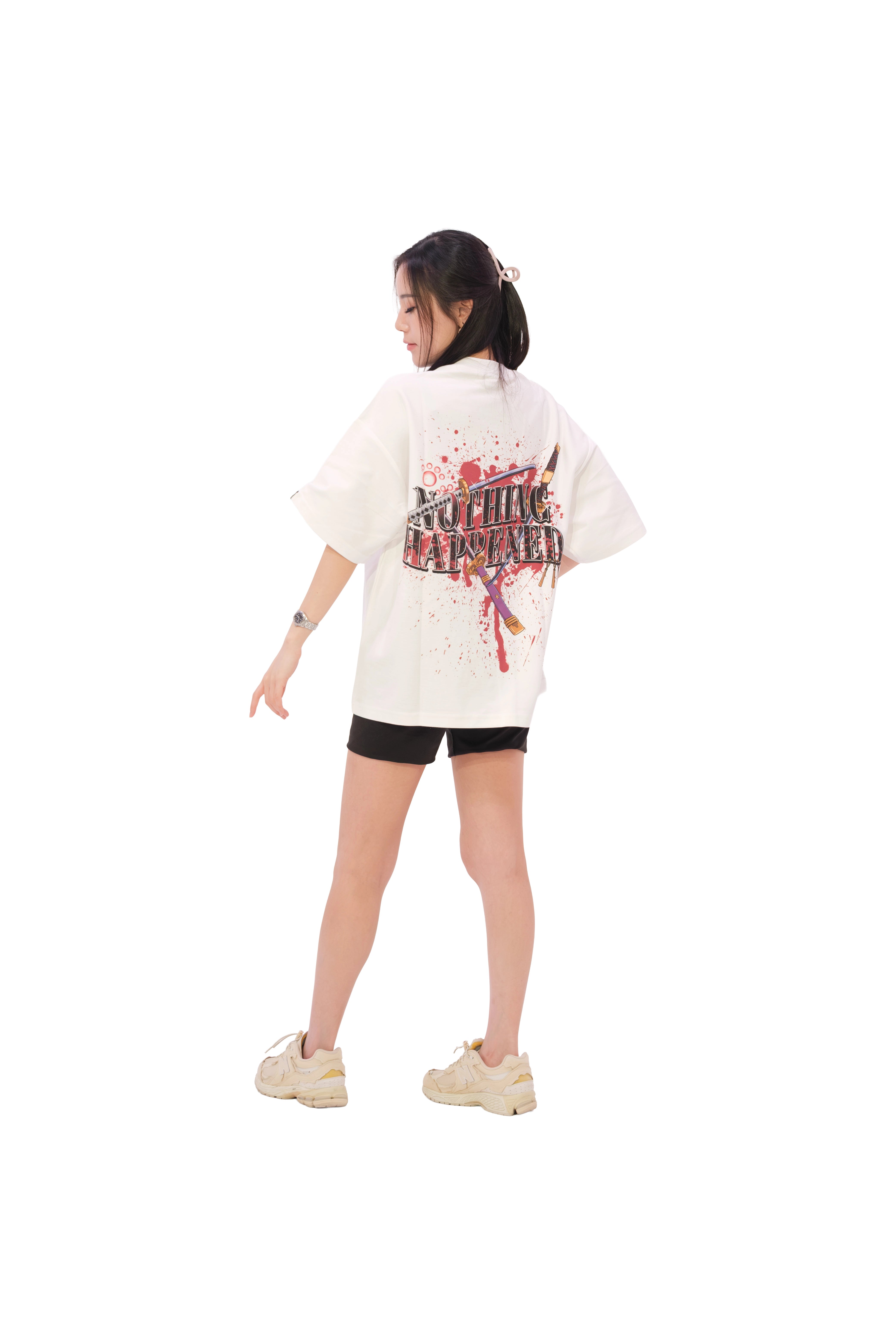 Back view of oversized white NO1 Apparels anime t-shirt, subtle anime clothing inspired by Zoro in One Piece, Nothing Happened design featuring Zoro's three swords, worn by female model.